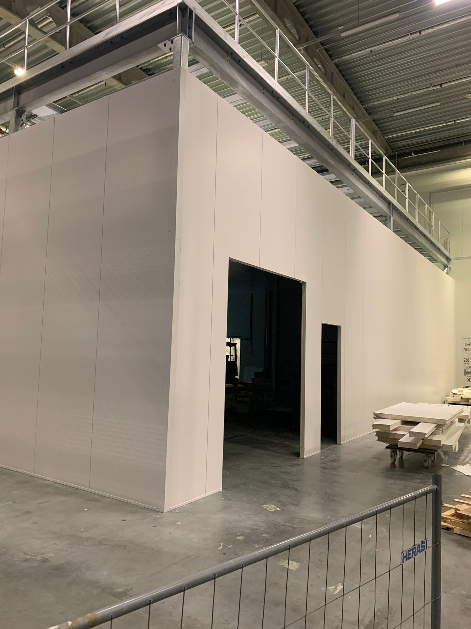 Sandwich panel enclosure inside an existing hall.